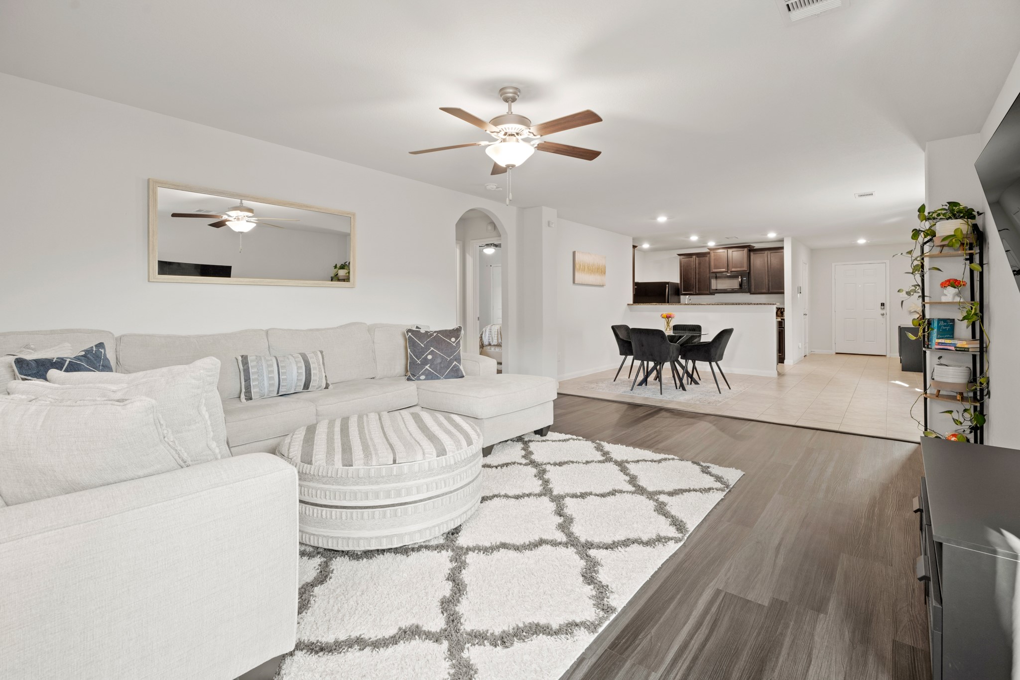 6214 El Topacio Drive Houston, TX 77048 - Photo 16 of 27 a living room with furniture and a chandelier