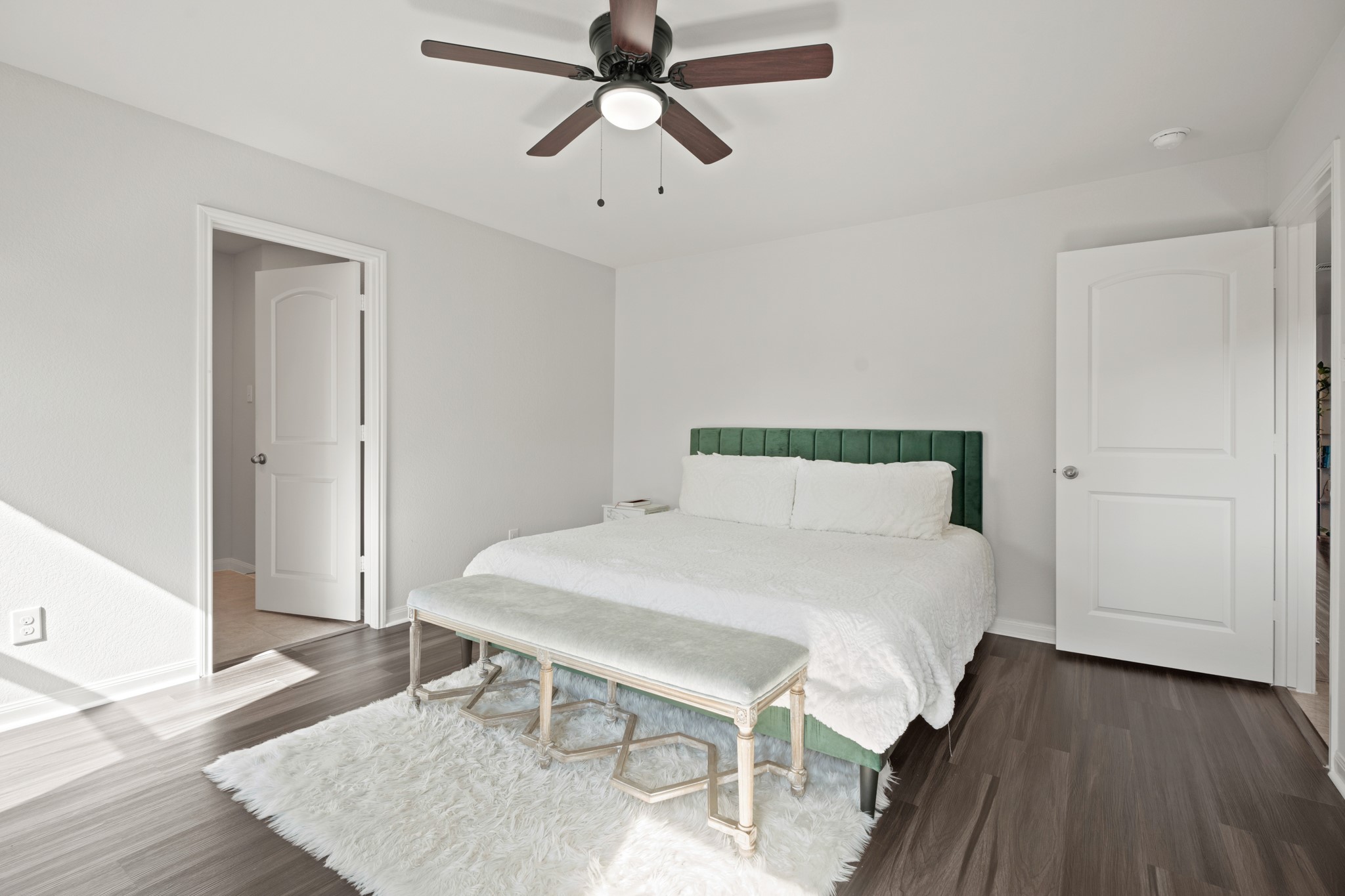 6214 El Topacio Drive Houston, TX 77048 - Photo 18 of 27 a bedroom with a bed and wooden floor