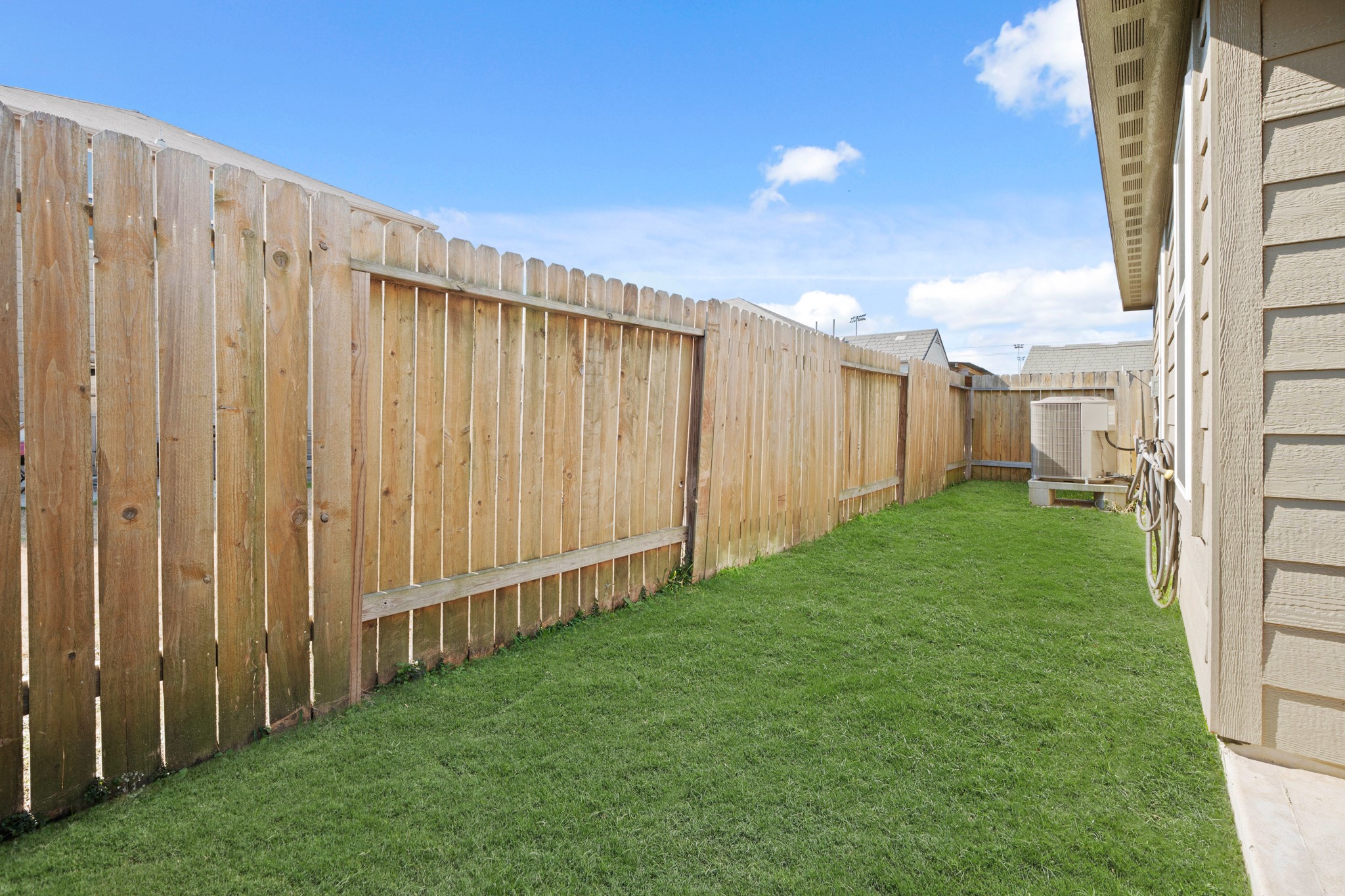 6214 El Topacio Drive Houston, TX 77048 - Photo 24 of 27 a view of a backyard with wooden fence