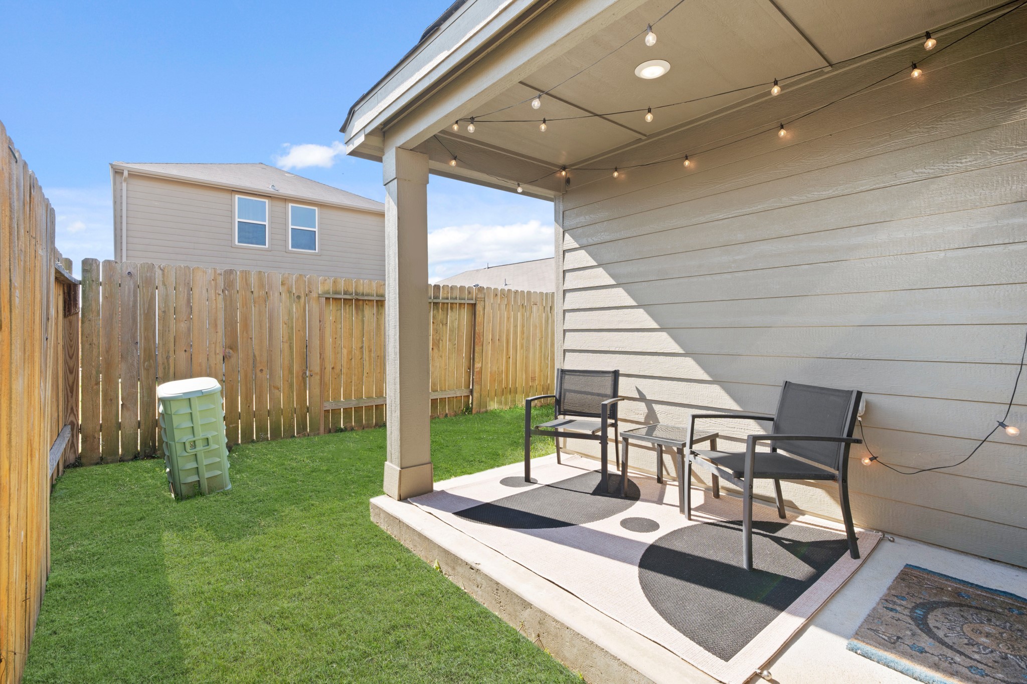 6214 El Topacio Drive Houston, TX 77048 - Photo 26 of 27 a view of a patio with table and chairs