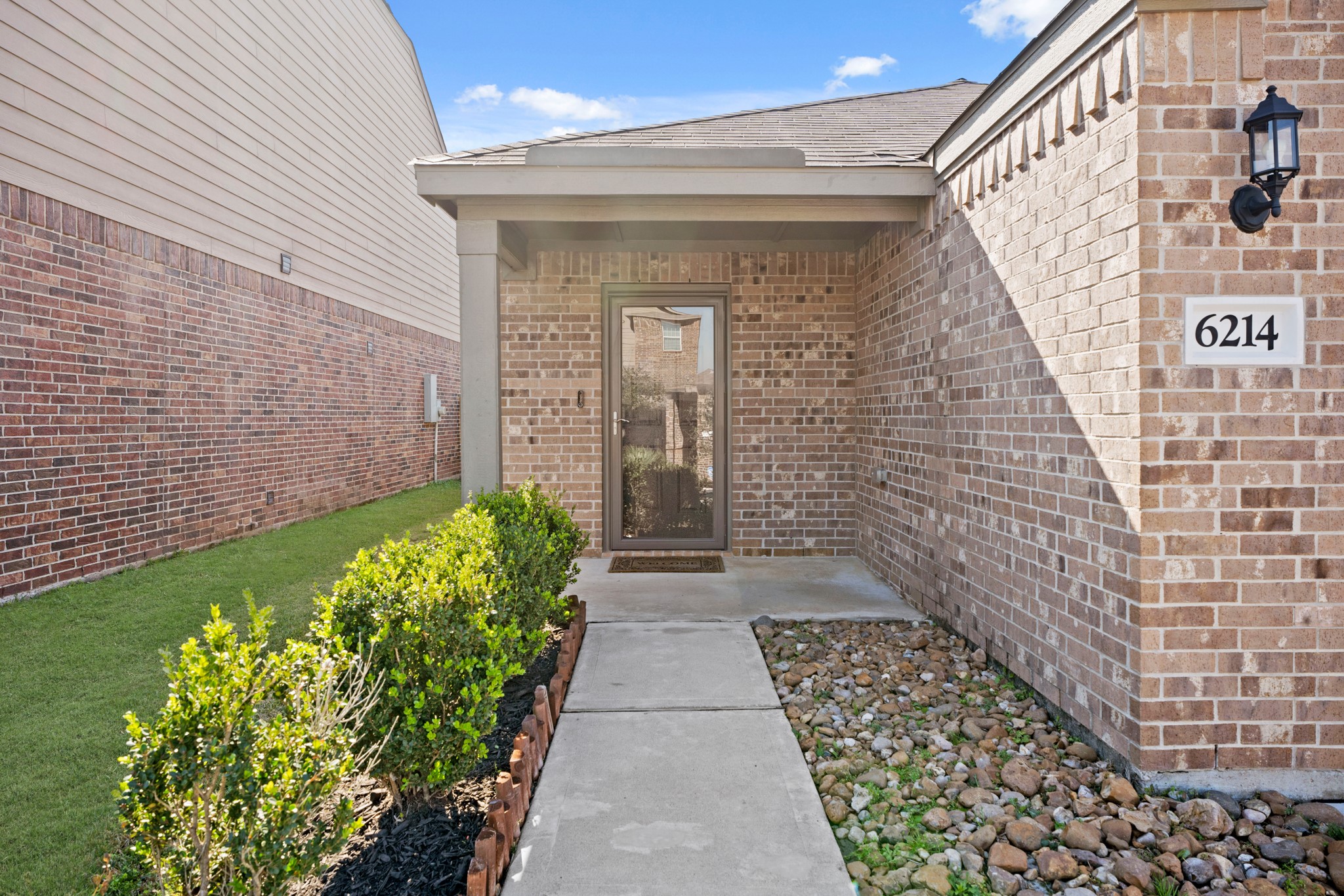 6214 El Topacio Drive Houston, TX 77048 - Photo 4 of 27 a view of a pathway with flower pots