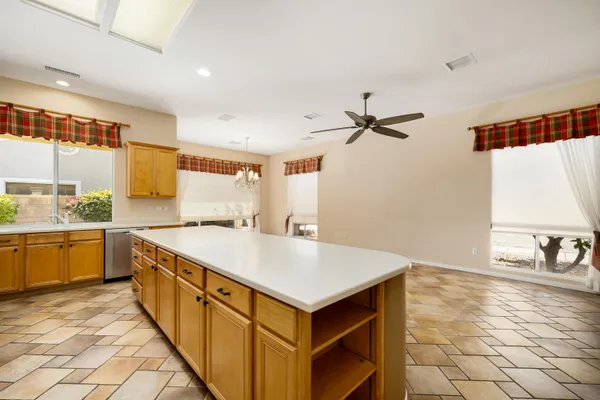 a spacious bathroom with a sink and a mirror
