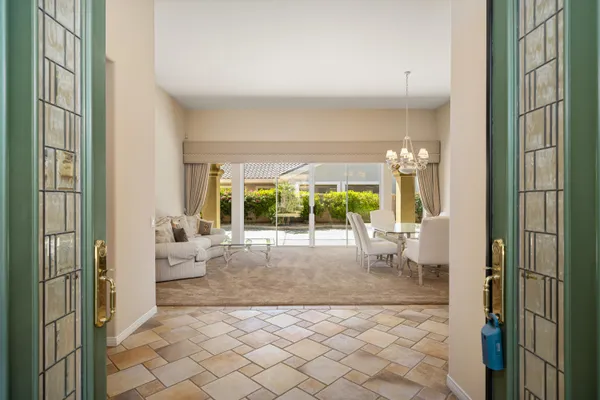 a living room with stainless steel appliances kitchen island granite countertop furniture and a kitchen view