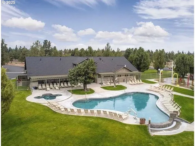 a view of a swimming pool with a garden