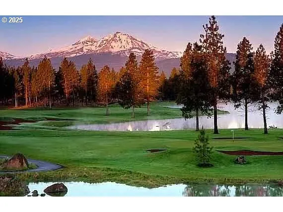 a view of a golf course with a lake