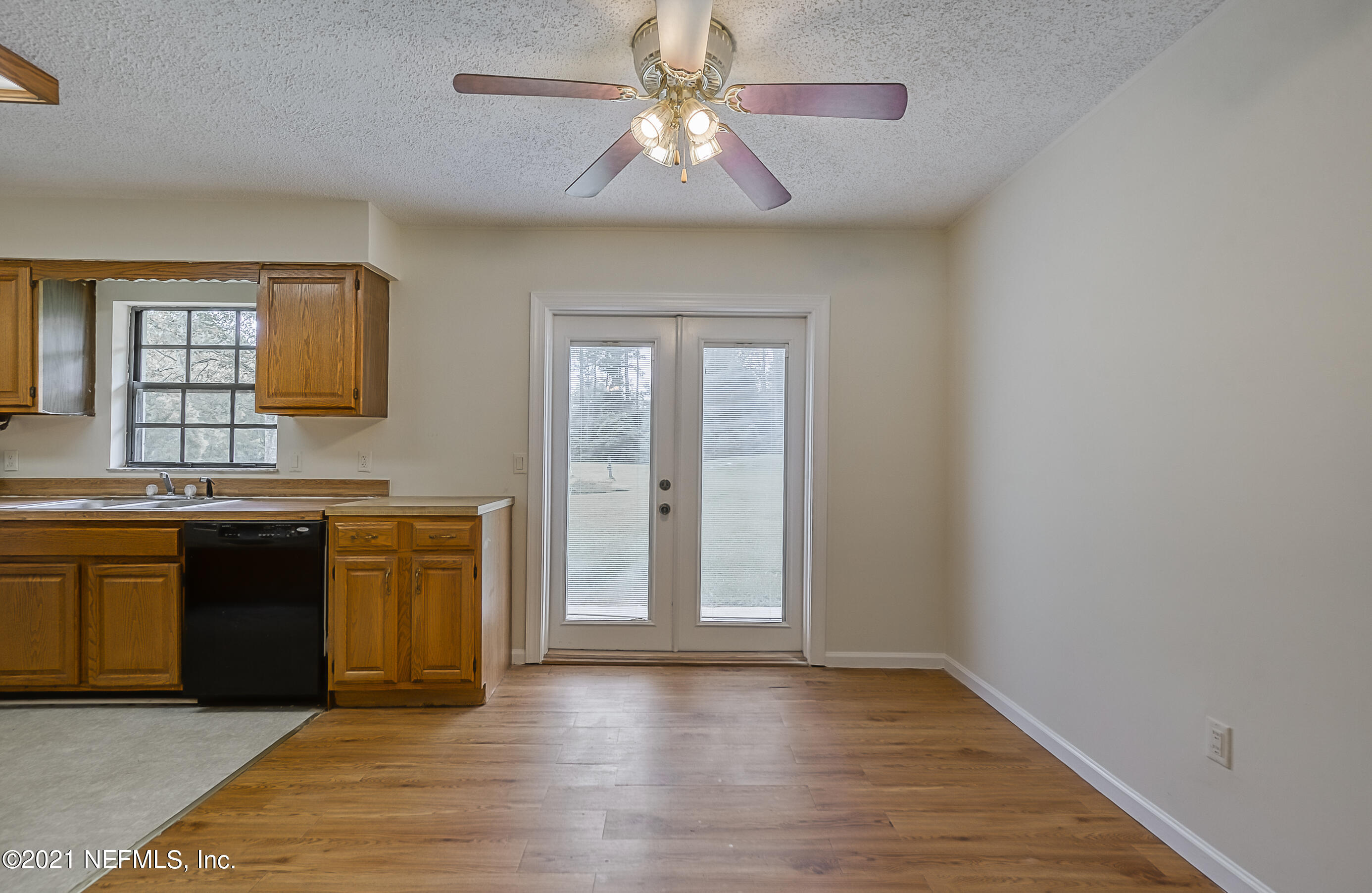 54212 Armstrong Road Callahan, FL 32011 - Photo 15 of 47 a view of an empty room with window and cabinet