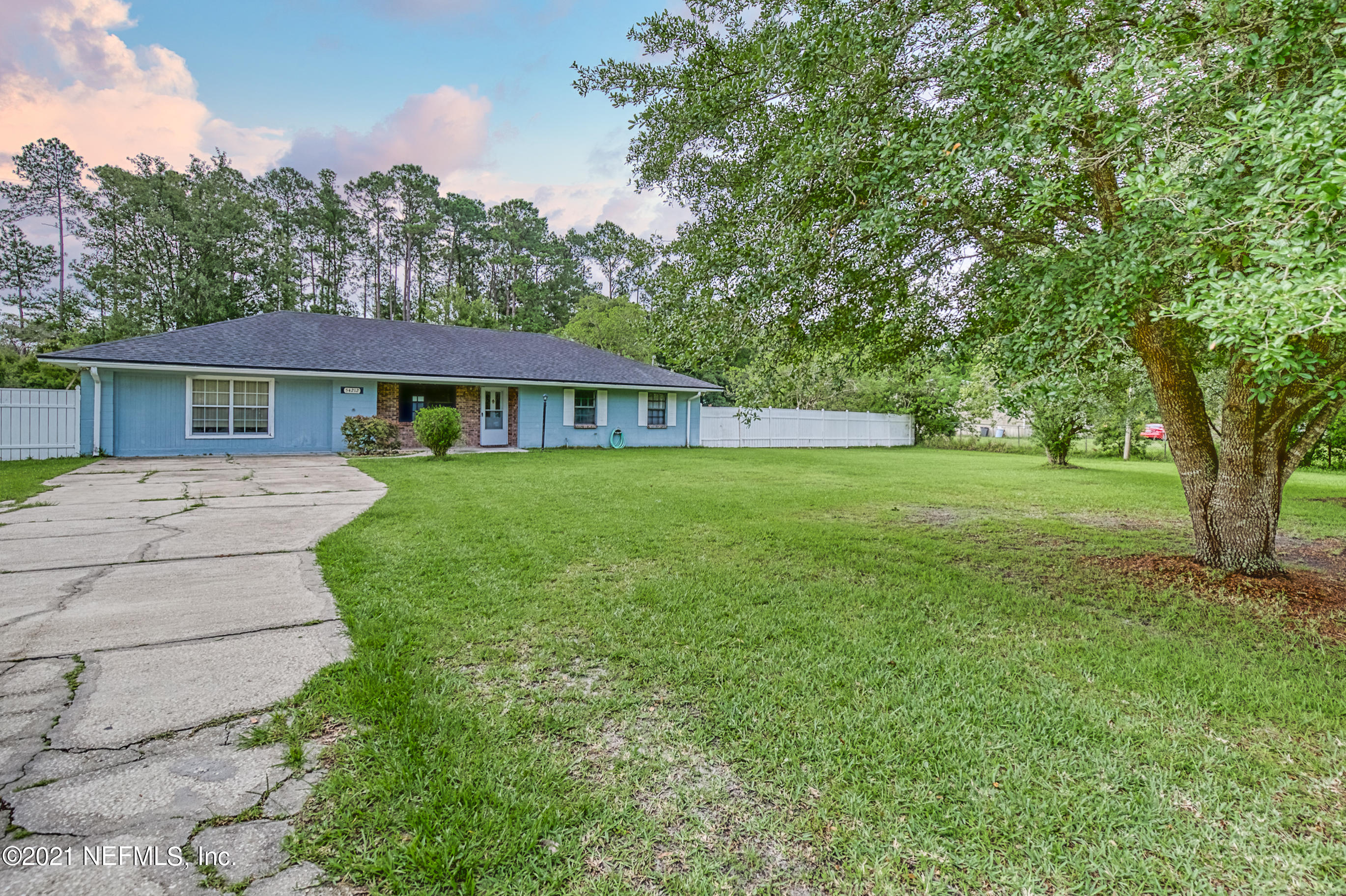 54212 Armstrong Road Callahan, FL 32011 - Photo 2 of 47 a house view with a garden space