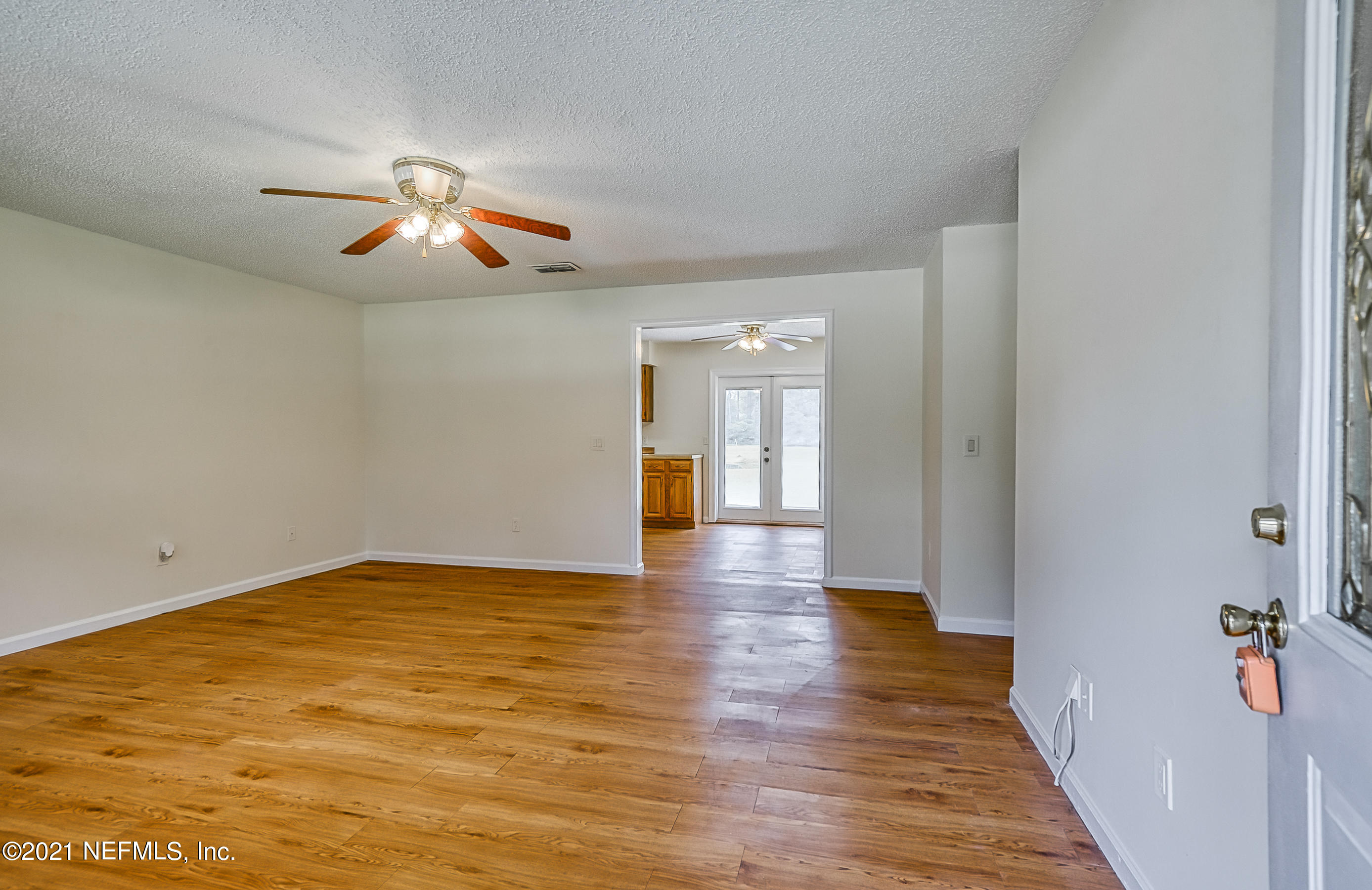 54212 Armstrong Road Callahan, FL 32011 - Photo 22 of 47 a view of empty room with wooden floor