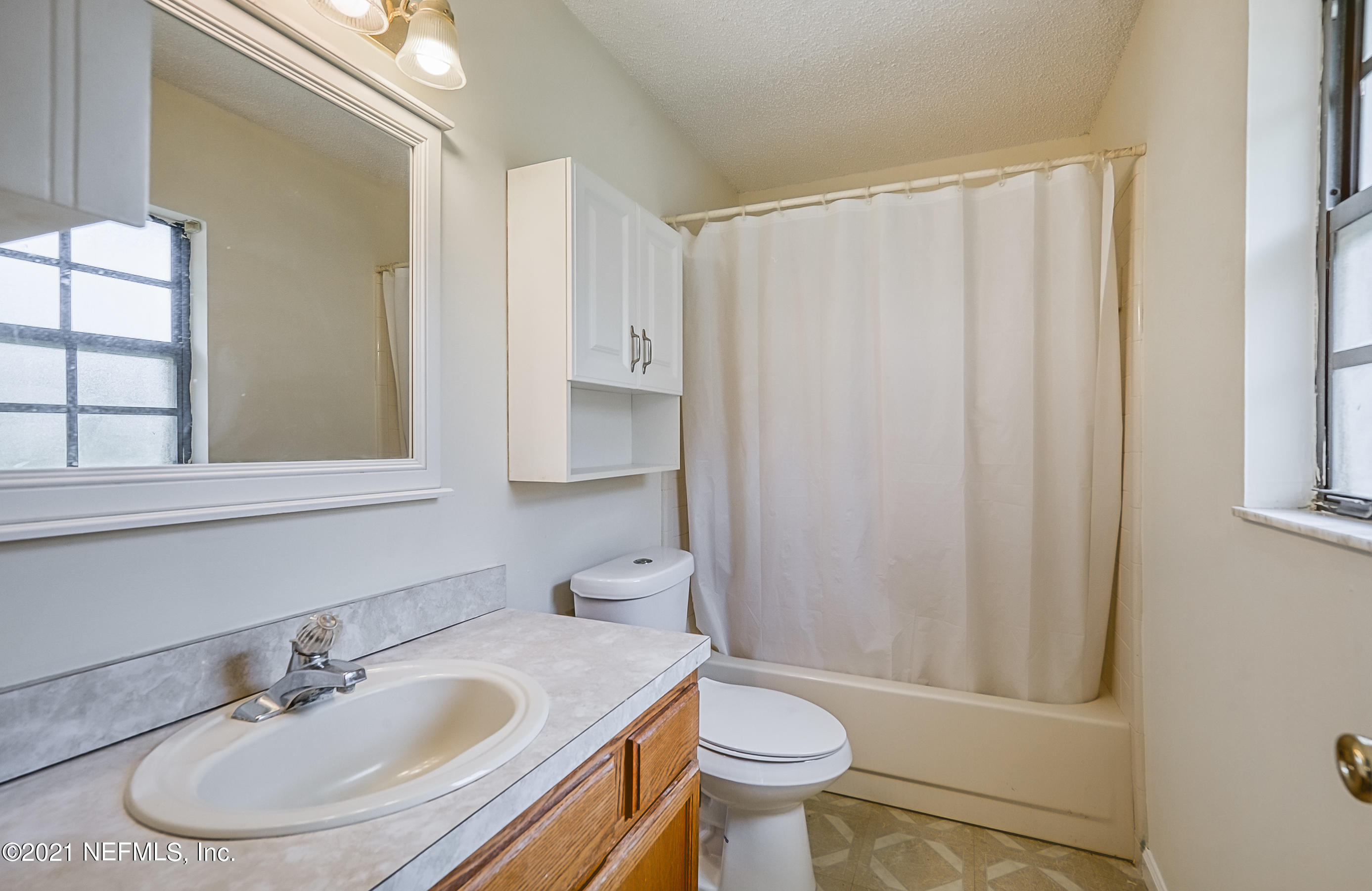 54212 Armstrong Road Callahan, FL 32011 - Photo 29 of 47 a bathroom with a sink toilet and shower