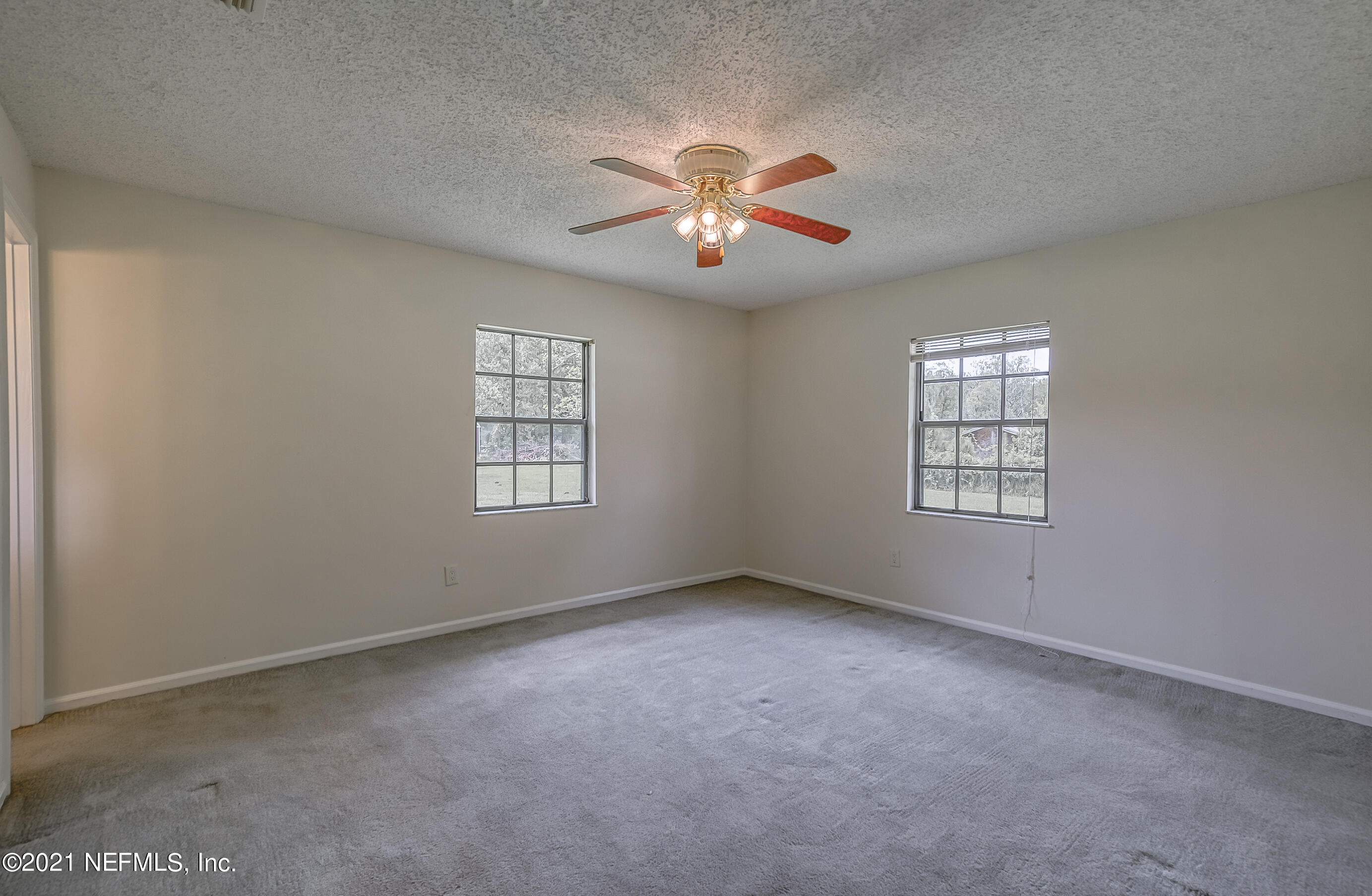 54212 Armstrong Road Callahan, FL 32011 - Photo 30 of 47 a view of an empty room with a window