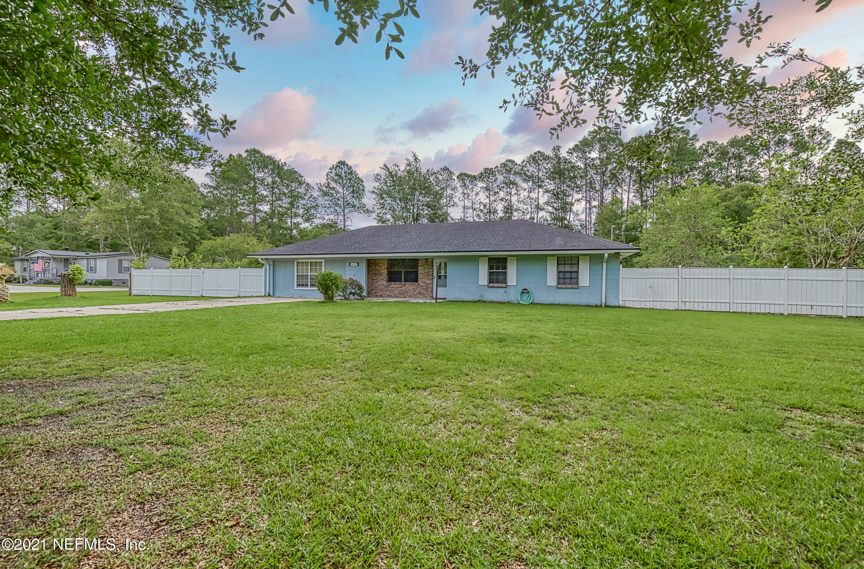 54212 Armstrong Road Callahan, FL 32011 - Photo 3 of 47 a front view of house with yard and green space