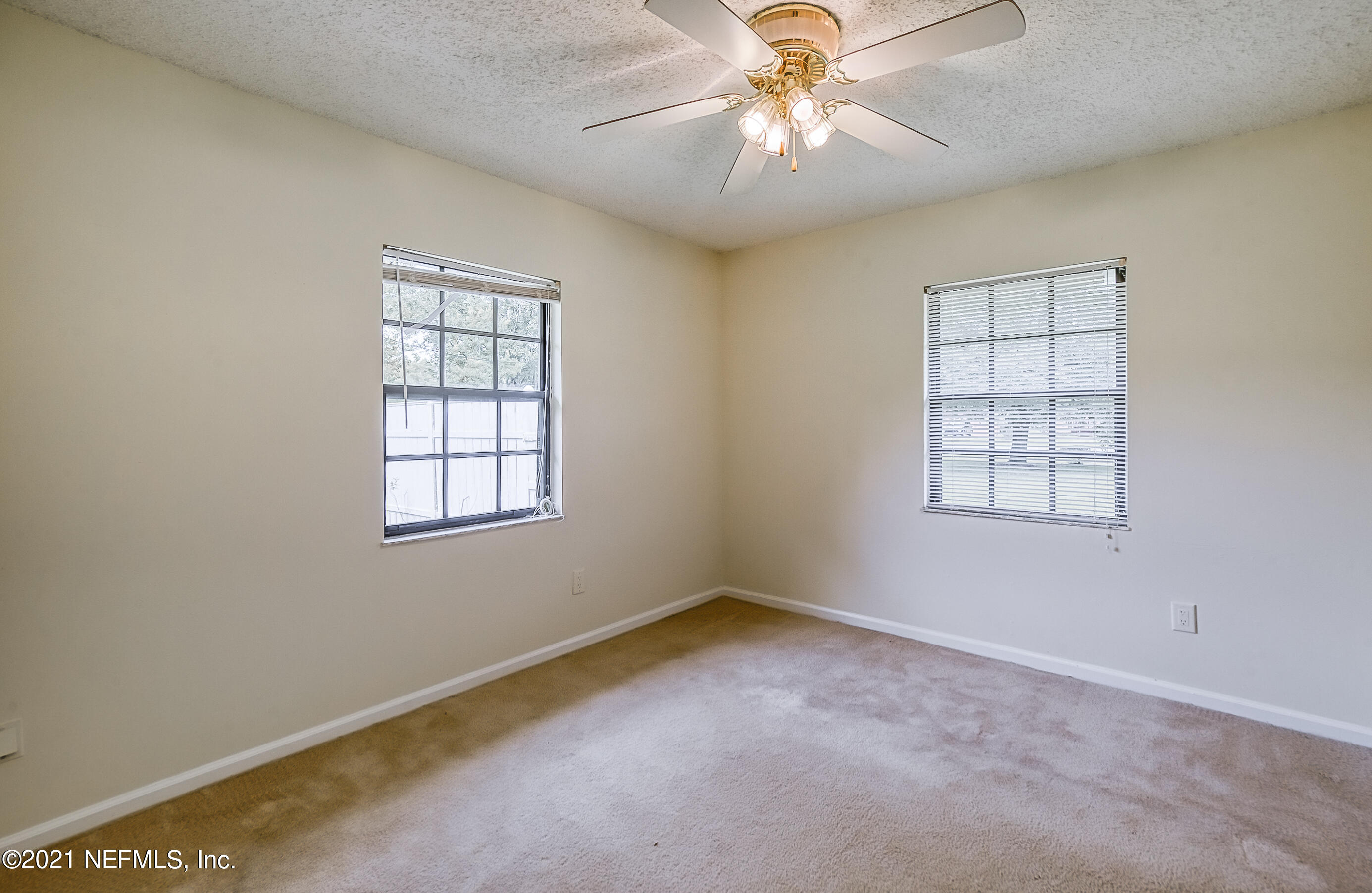 54212 Armstrong Road Callahan, FL 32011 - Photo 31 of 47 an empty room with windows and fan