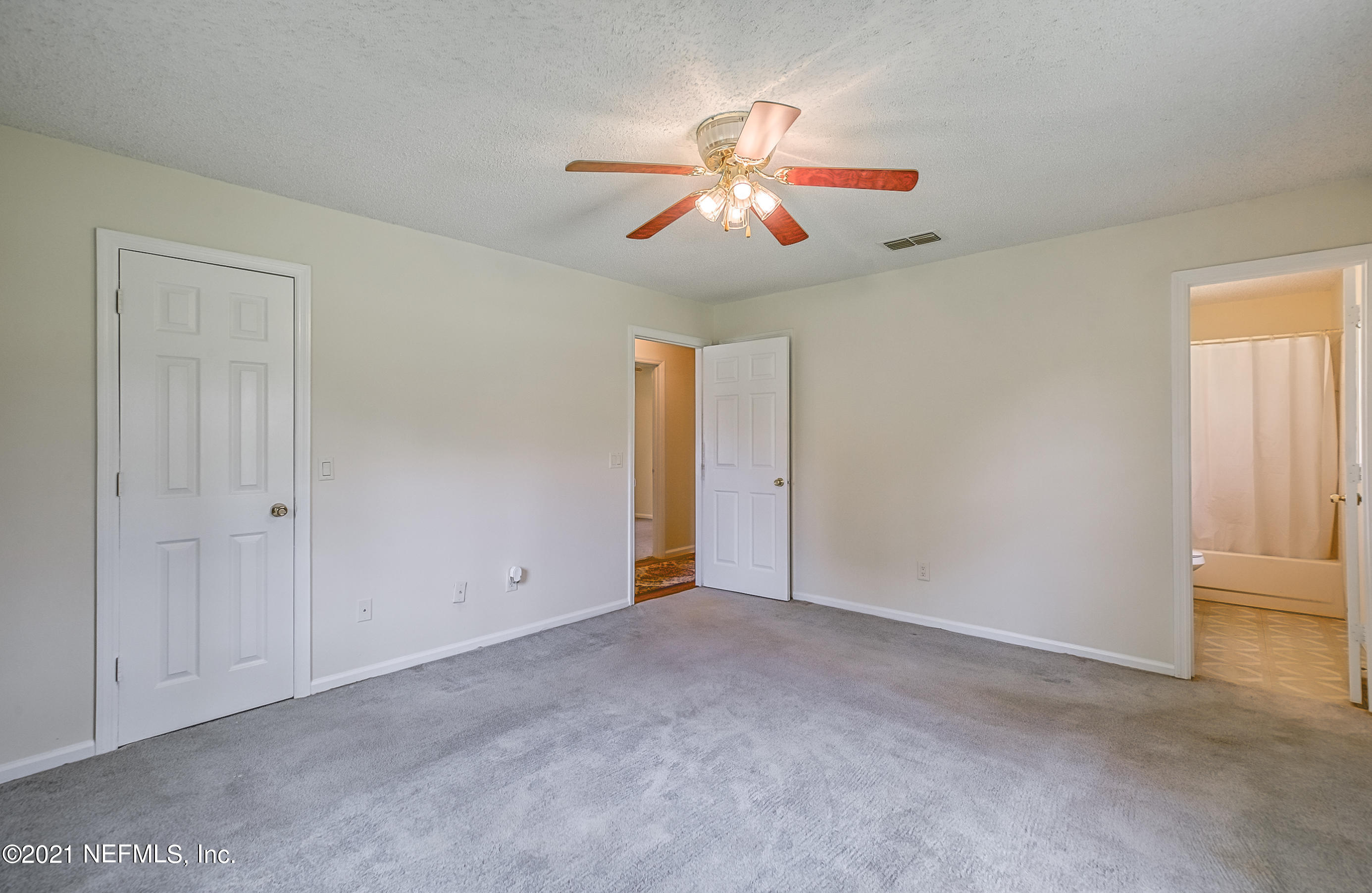 54212 Armstrong Road Callahan, FL 32011 - Photo 34 of 47 an empty room with closet and fan