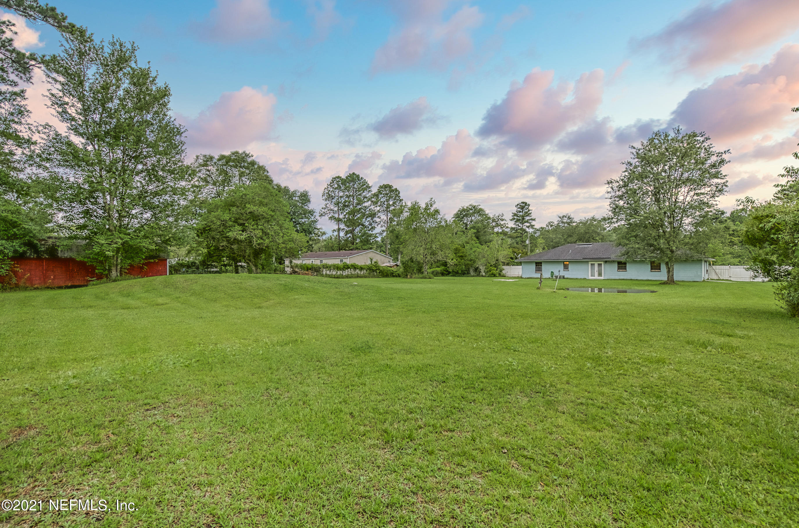 54212 Armstrong Road Callahan, FL 32011 - Photo 4 of 47 a backyard of a house with lots of green space
