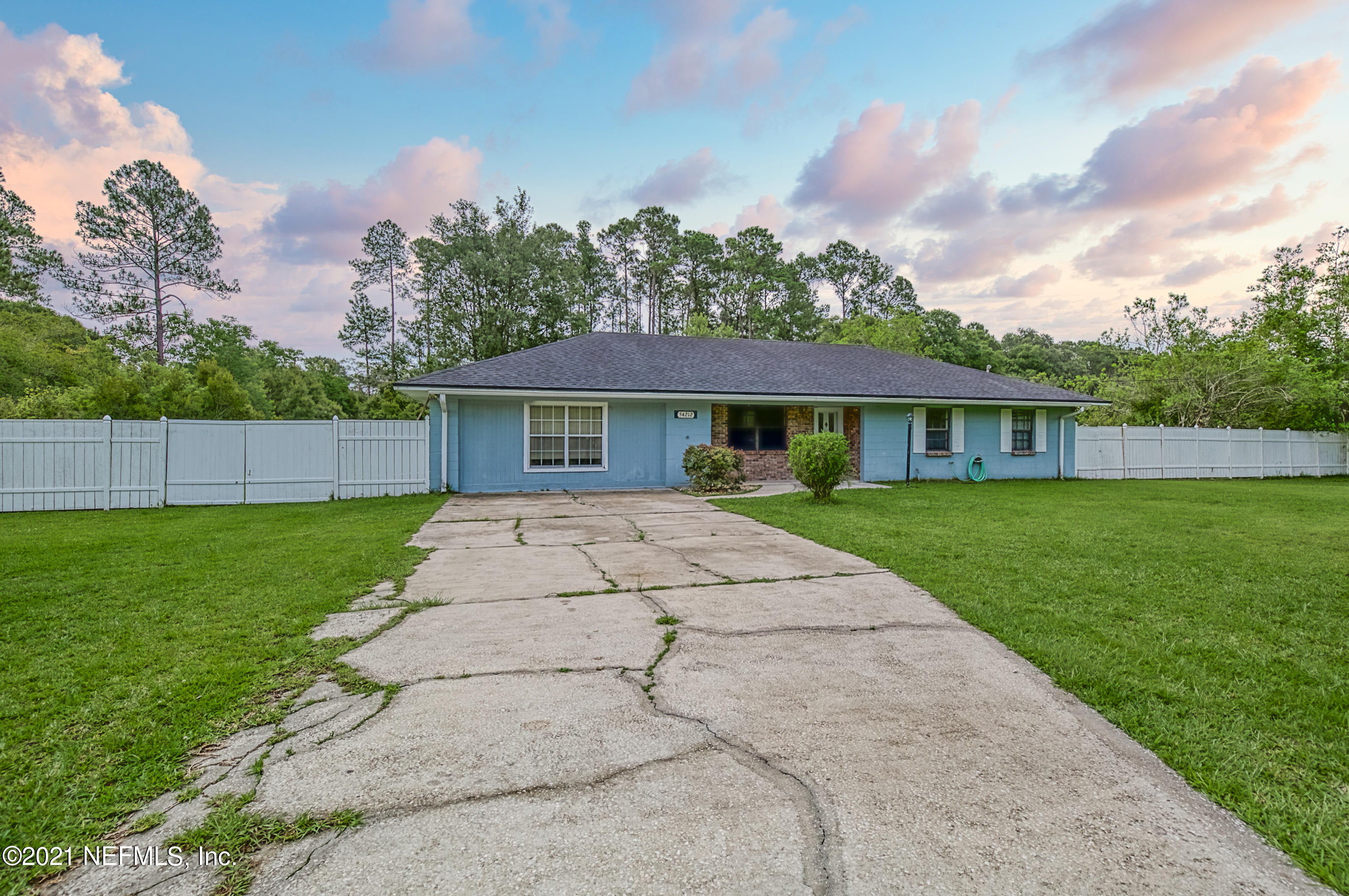 54212 Armstrong Road Callahan, FL 32011 - Photo 41 of 47 a view of house with a yard