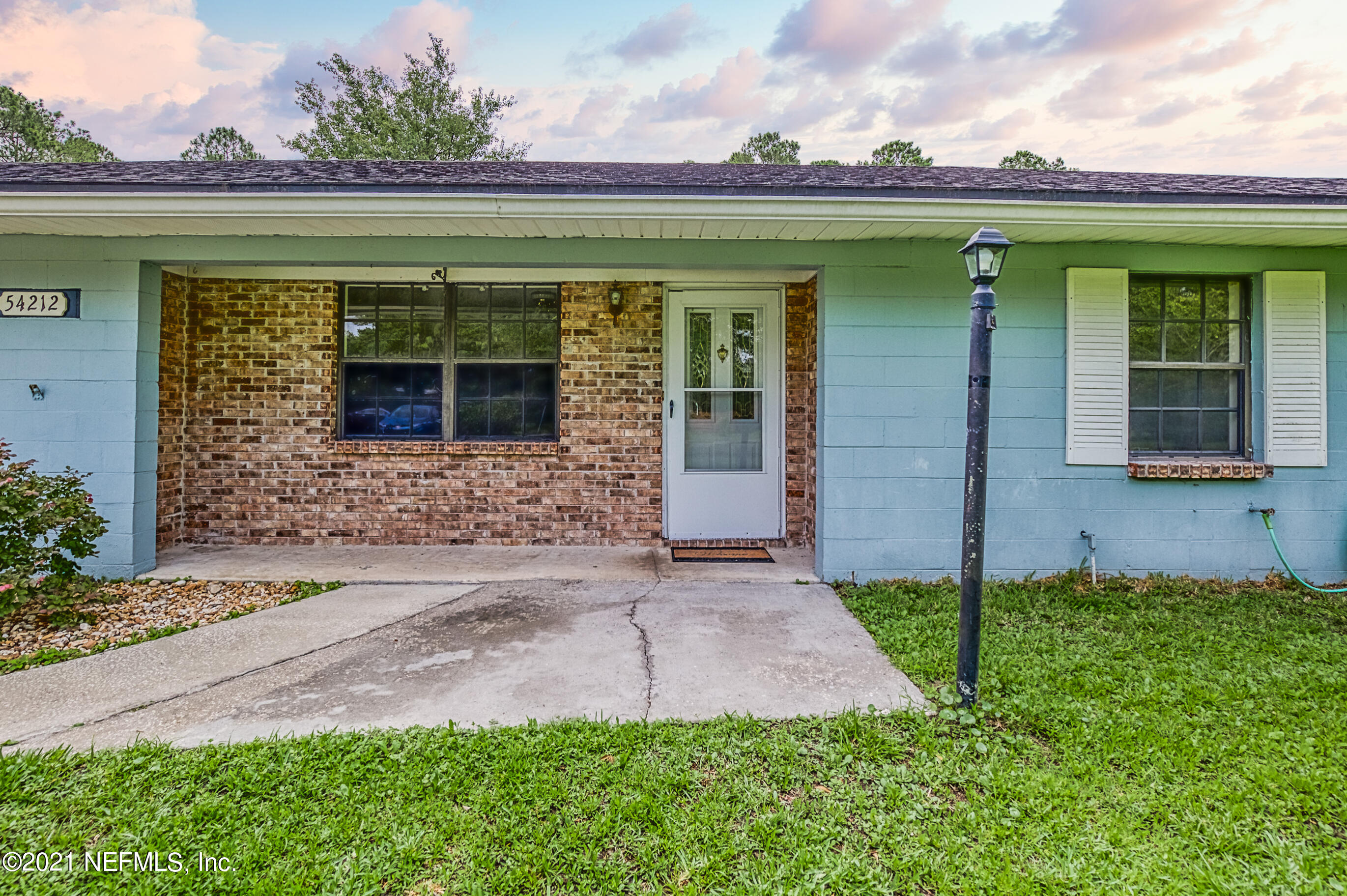 54212 Armstrong Road Callahan, FL 32011 - Photo 43 of 47 front view of a house with a yard