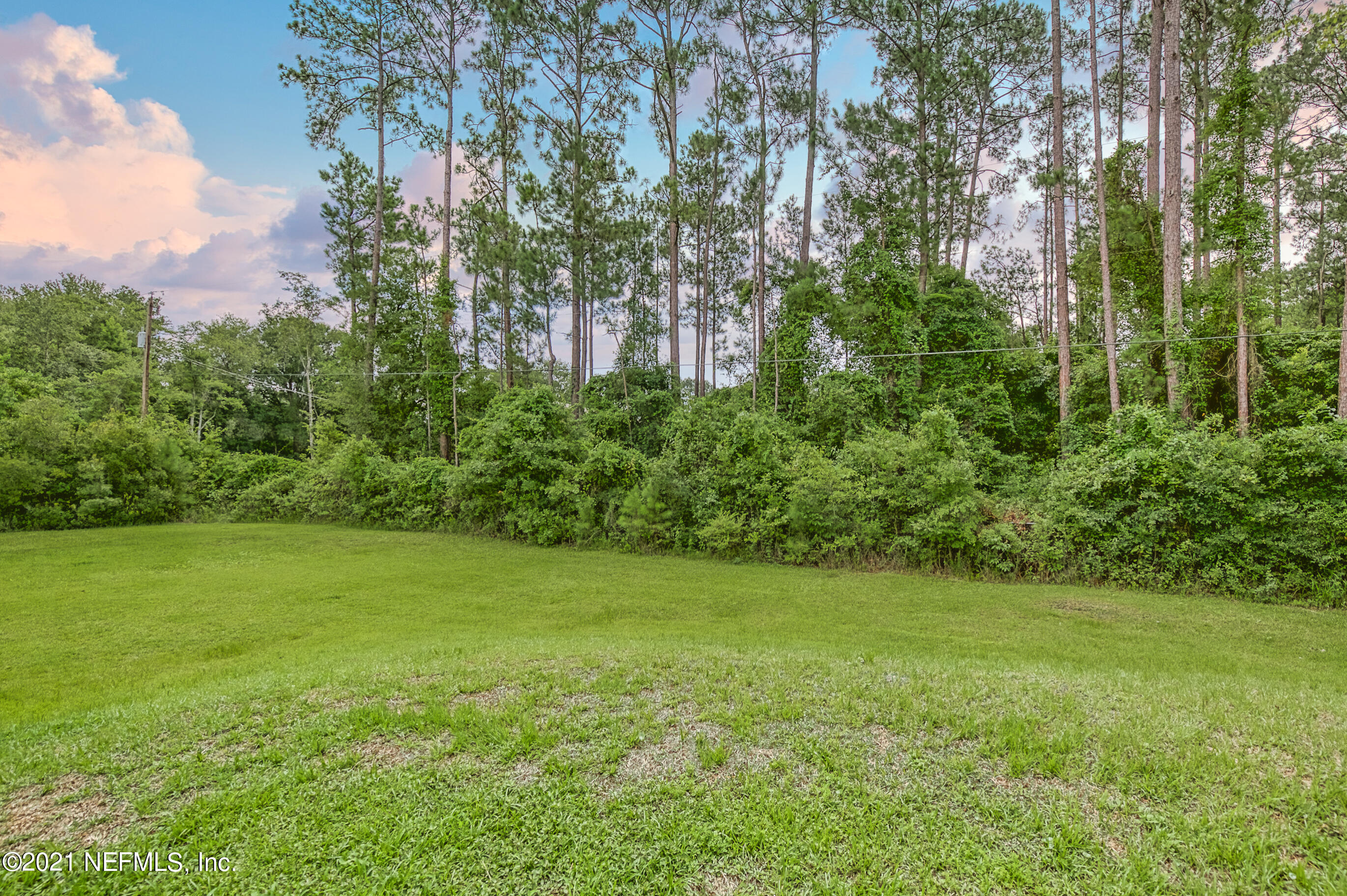 54212 Armstrong Road Callahan, FL 32011 - Photo 45 of 47 a view of a garden with a building