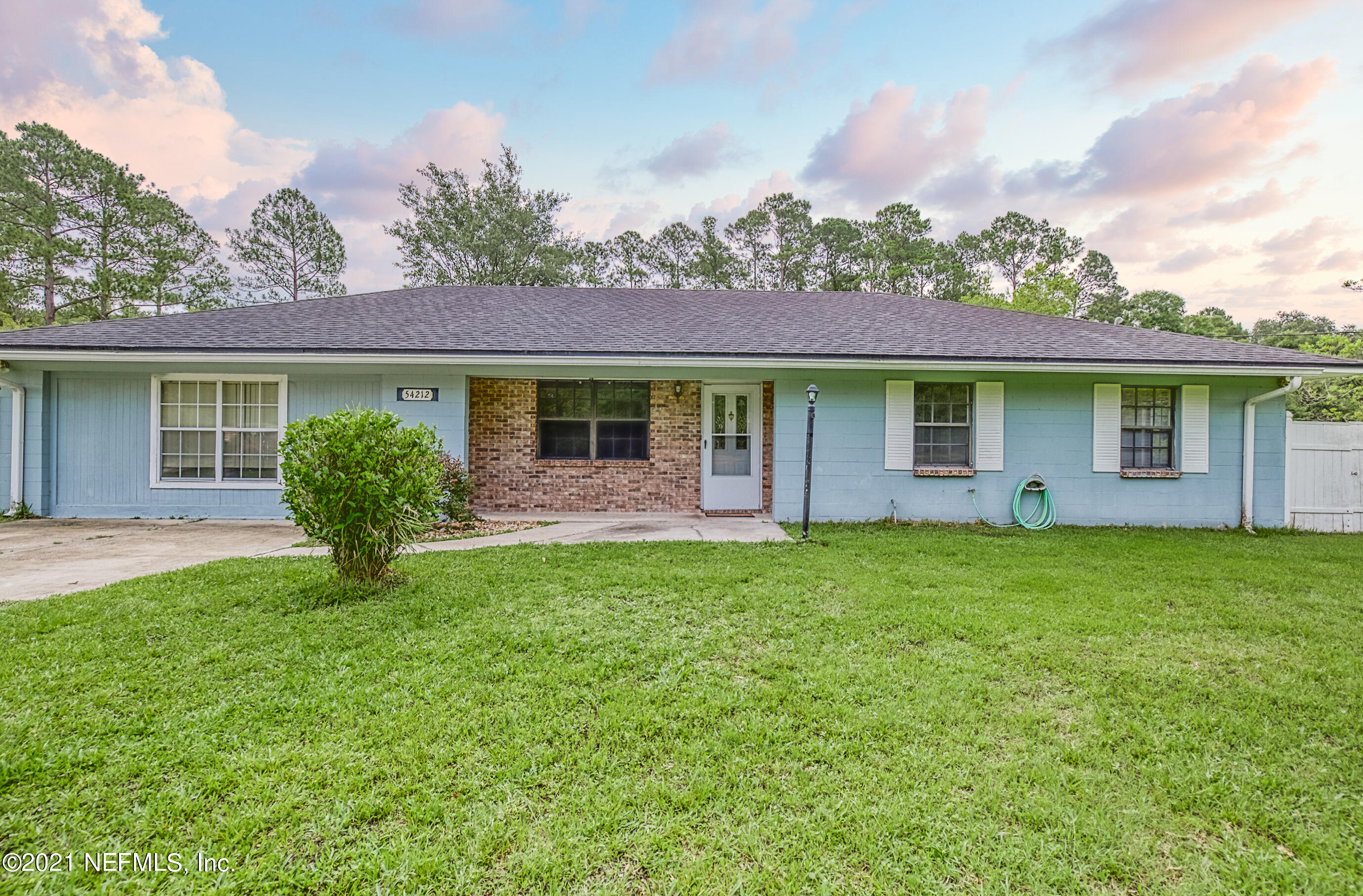 54212 Armstrong Road Callahan, FL 32011 - Photo 6 of 47 a view of a house with backyard and garden