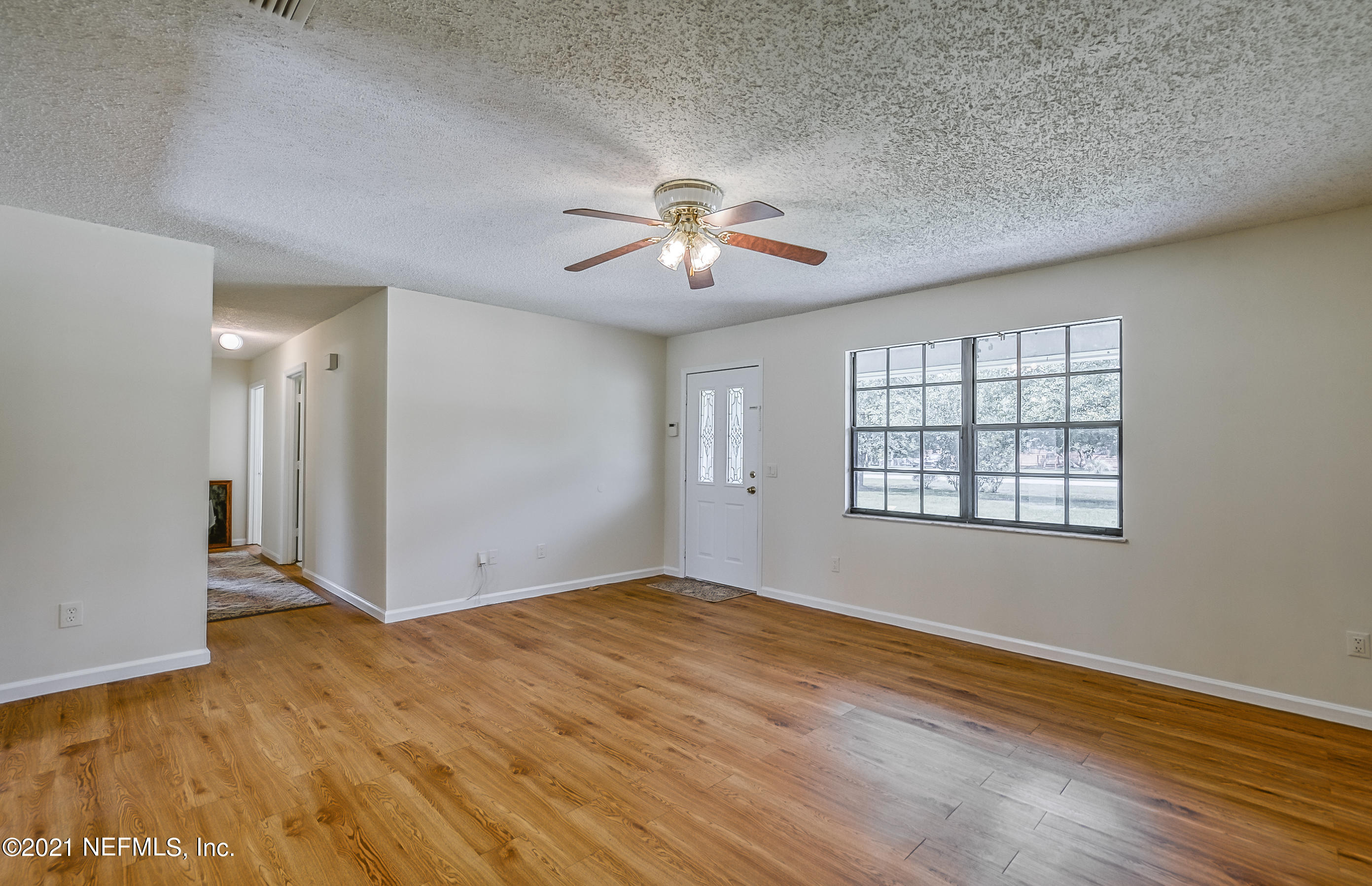 54212 Armstrong Road Callahan, FL 32011 - Photo 8 of 47 a view of a room with a ceiling fan and window