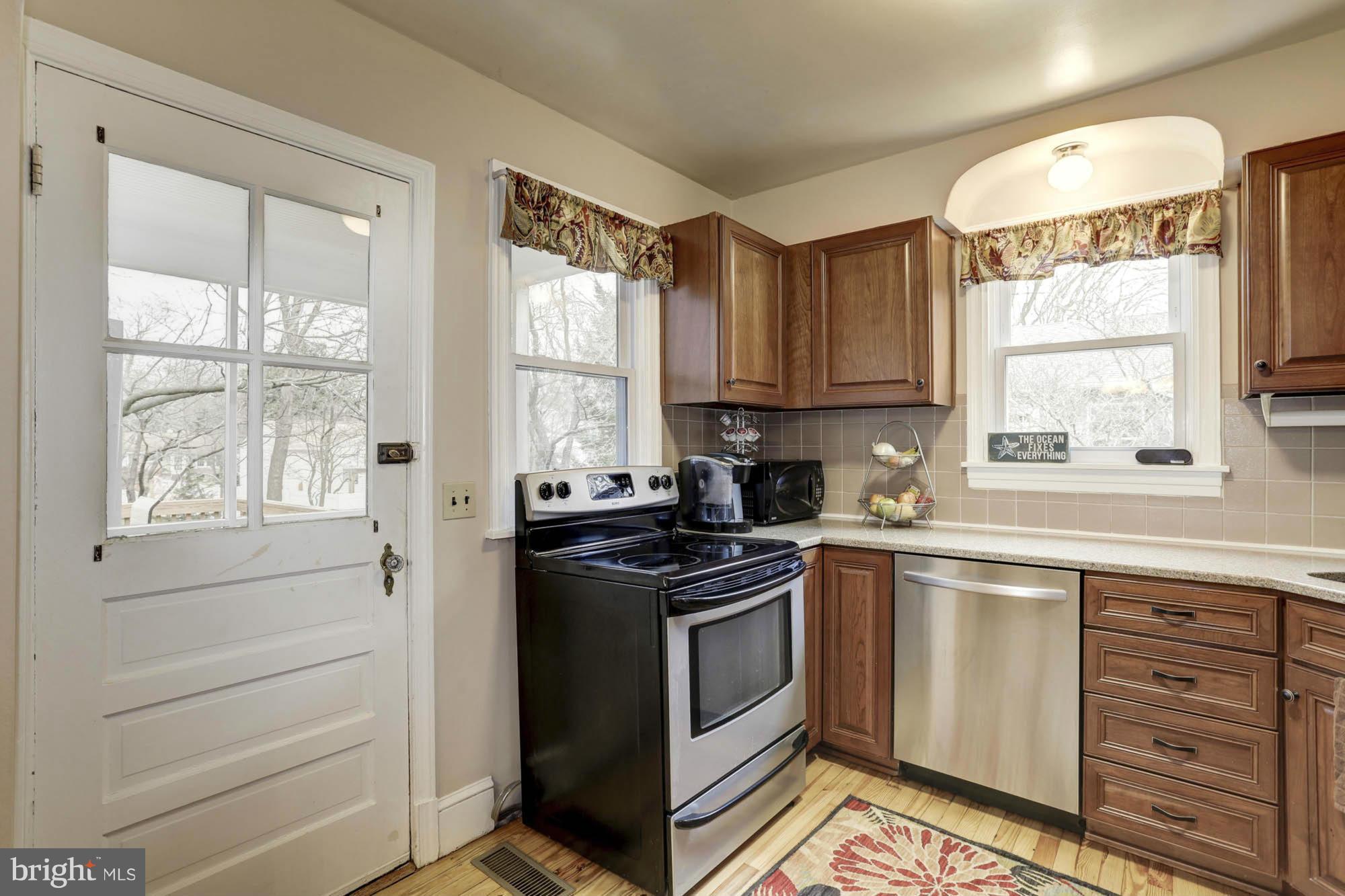 213 Gibson Road Annapolis, MD 21401 - Photo 15 of 30 Kitchen Walk-Out to Screened Porch and Deck