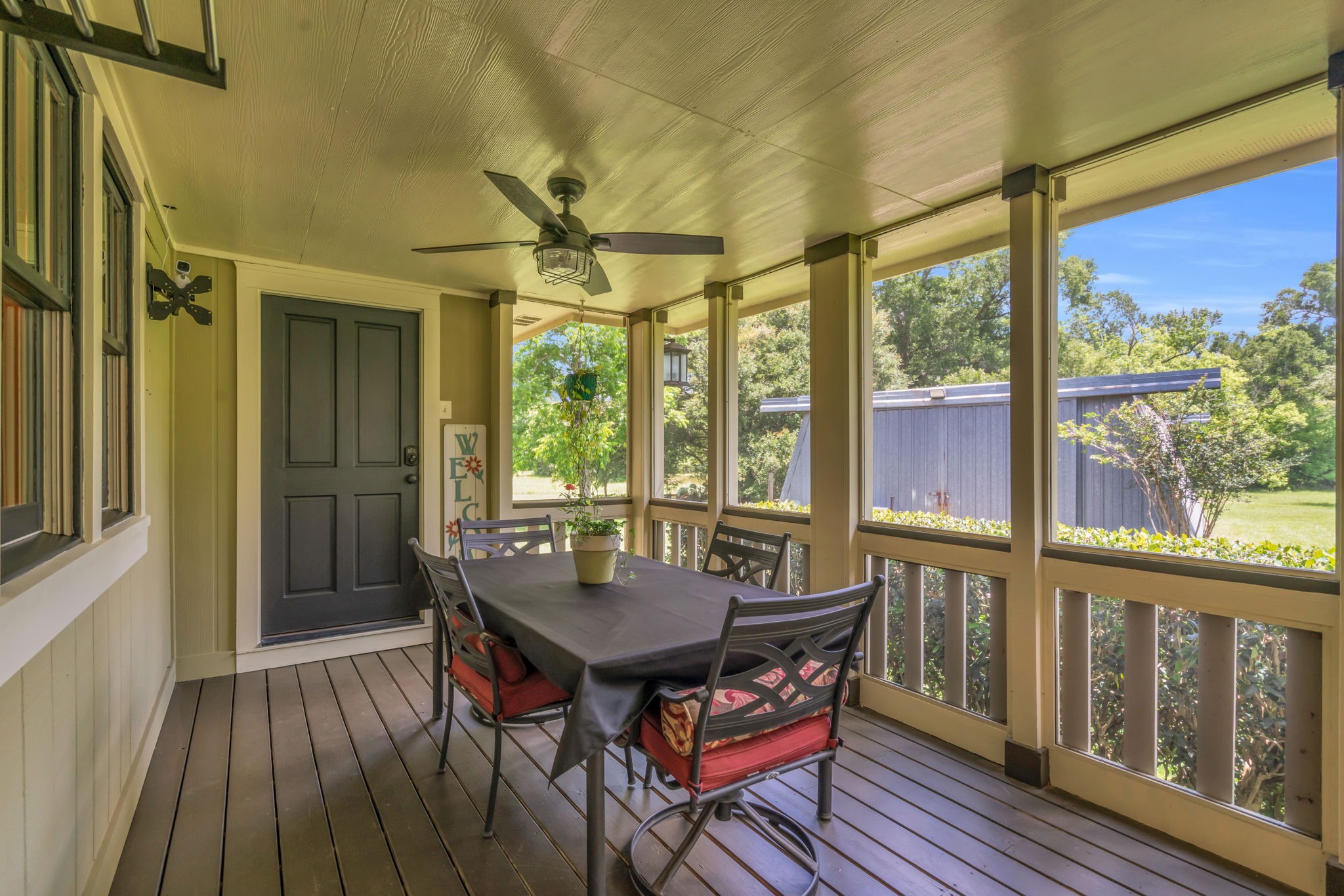 17821 Brown Road Conroe, TX 77306 - Photo 32 of 50 a view of a balcony with furniture and wooden floor