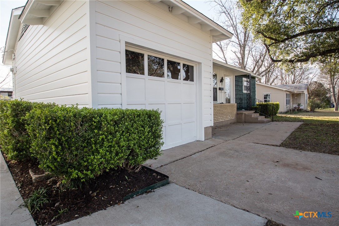 2019 South 9th Street Temple, TX 76504 - Photo 4 of 23 Very nicely landscaped home with front patio, flower box, mature trees.