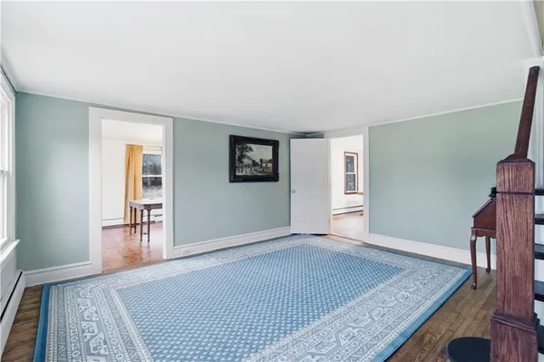 an empty room with windows and closet