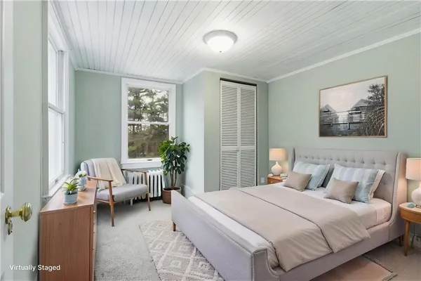 a bedroom with a bed and a couch