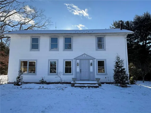 front view of a house with a yard