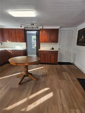 a room with furniture and a flat screen tv