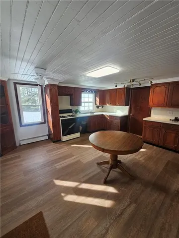 a kitchen with furniture and a fireplace