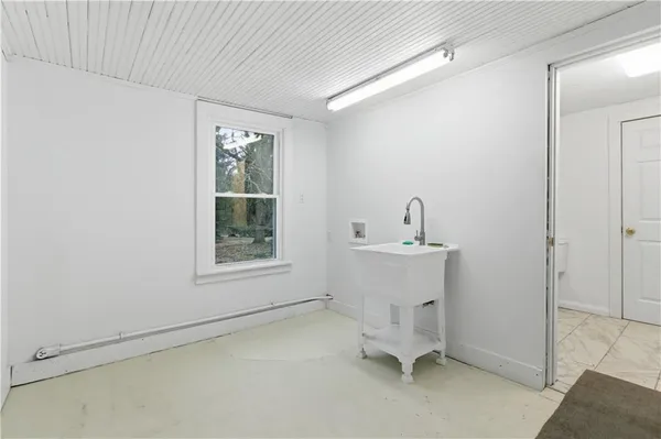 a room with a sink and a window