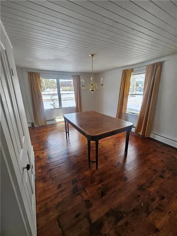 a view of a room with furniture window and wooden floor