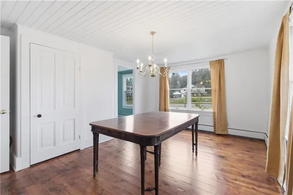 a view of a room with furniture window and wooden floor