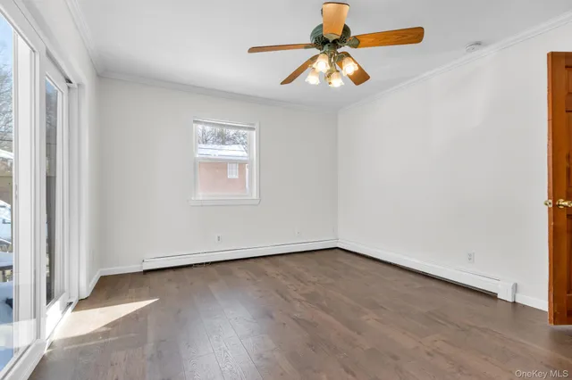 a view of a house with a yard covered with snow