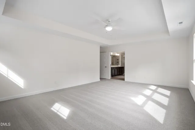 an empty room with closet area