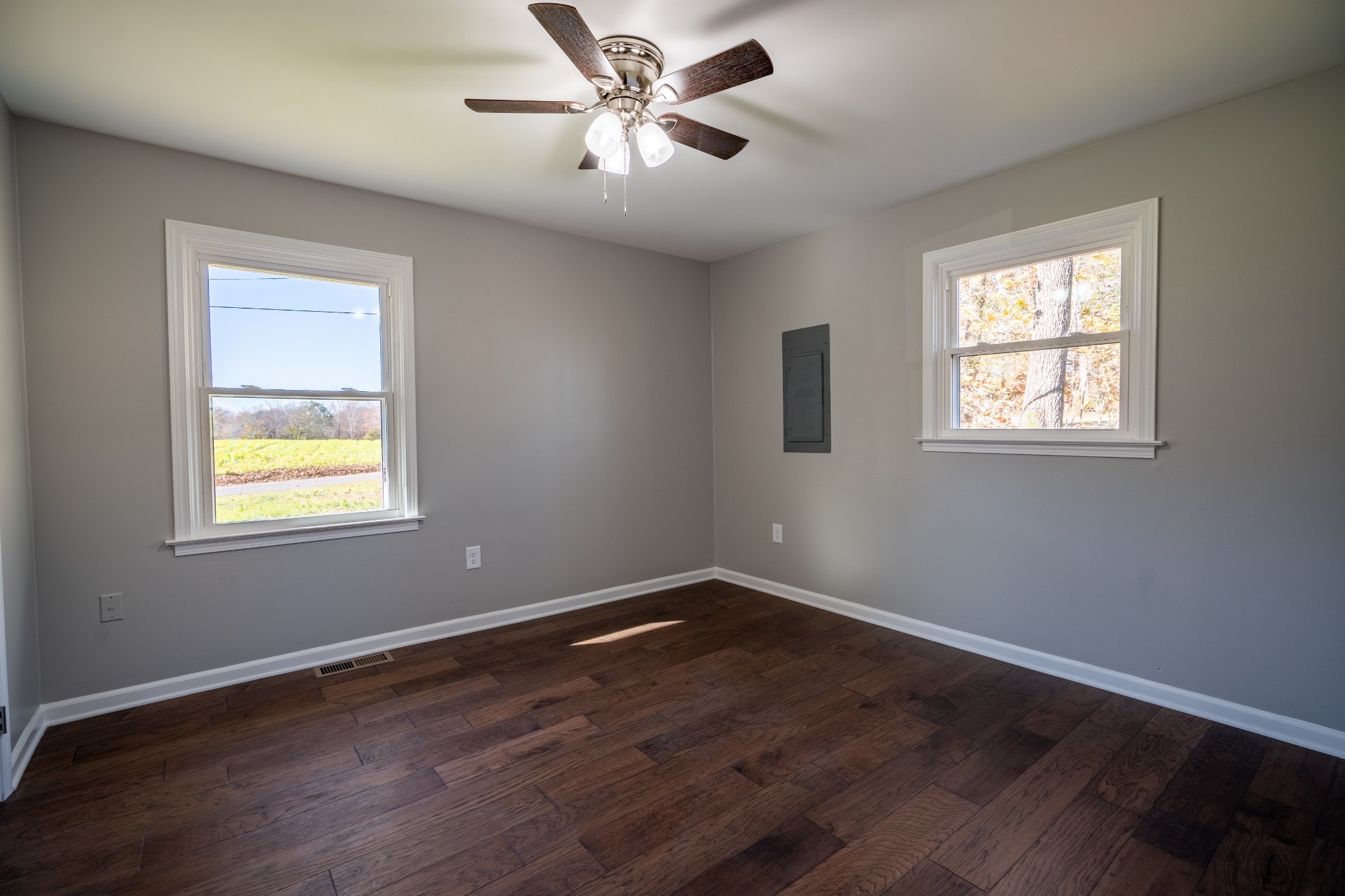 3993 Clanton Road Lawrenceburg, TN 38464 - Photo 17 of 24 a view of an empty room with wooden floor and a window