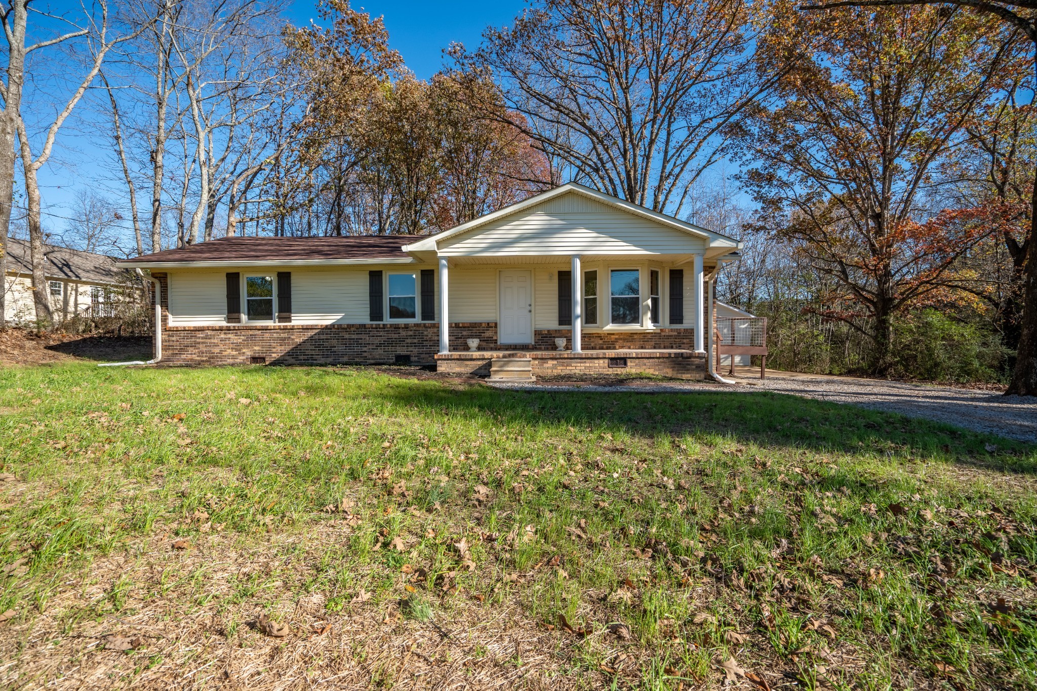 3993 Clanton Road Lawrenceburg, TN 38464 - Photo 2 of 24 a front view of a house with a yard table and chairs
