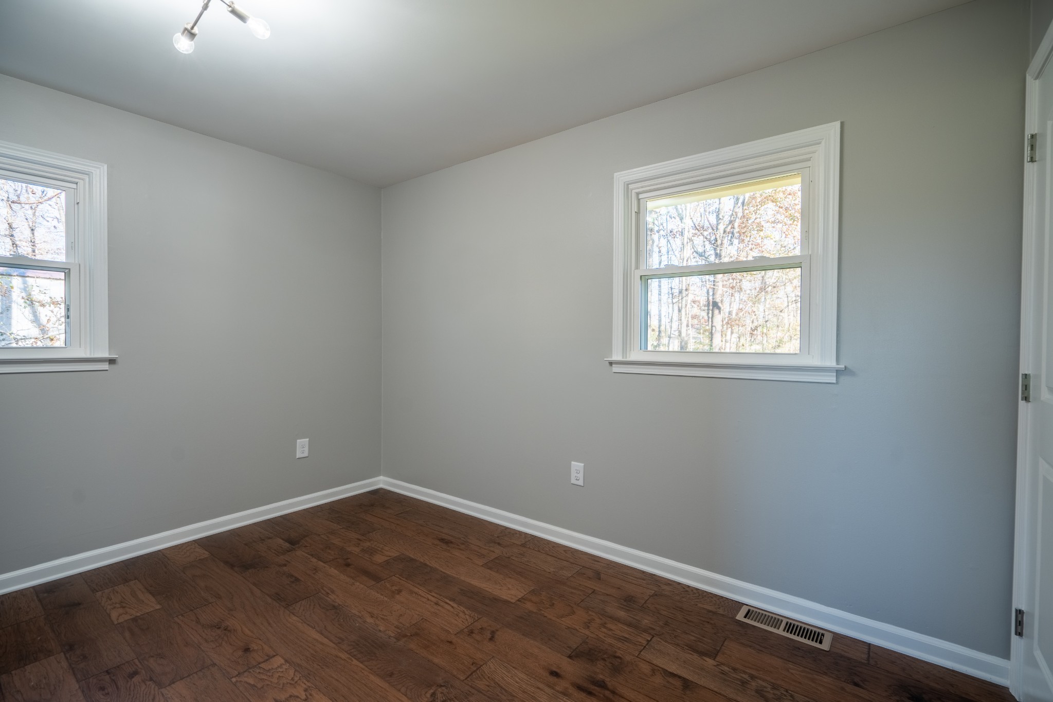 3993 Clanton Road Lawrenceburg, TN 38464 - Photo 22 of 24 a view of an empty room with wooden floor and a window