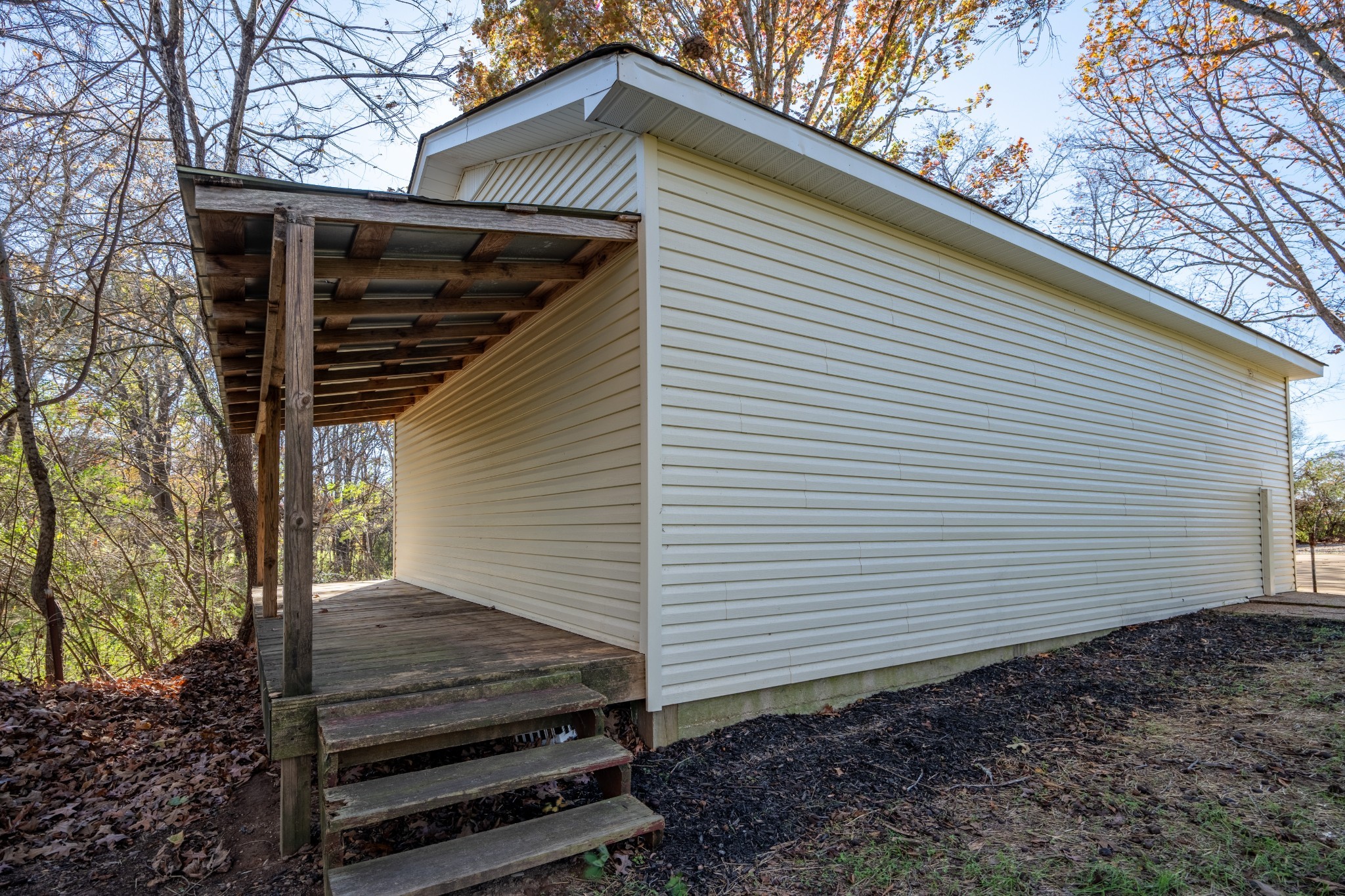 3993 Clanton Road Lawrenceburg, TN 38464 - Photo 7 of 24 a view of a small house and yard with wooden fence