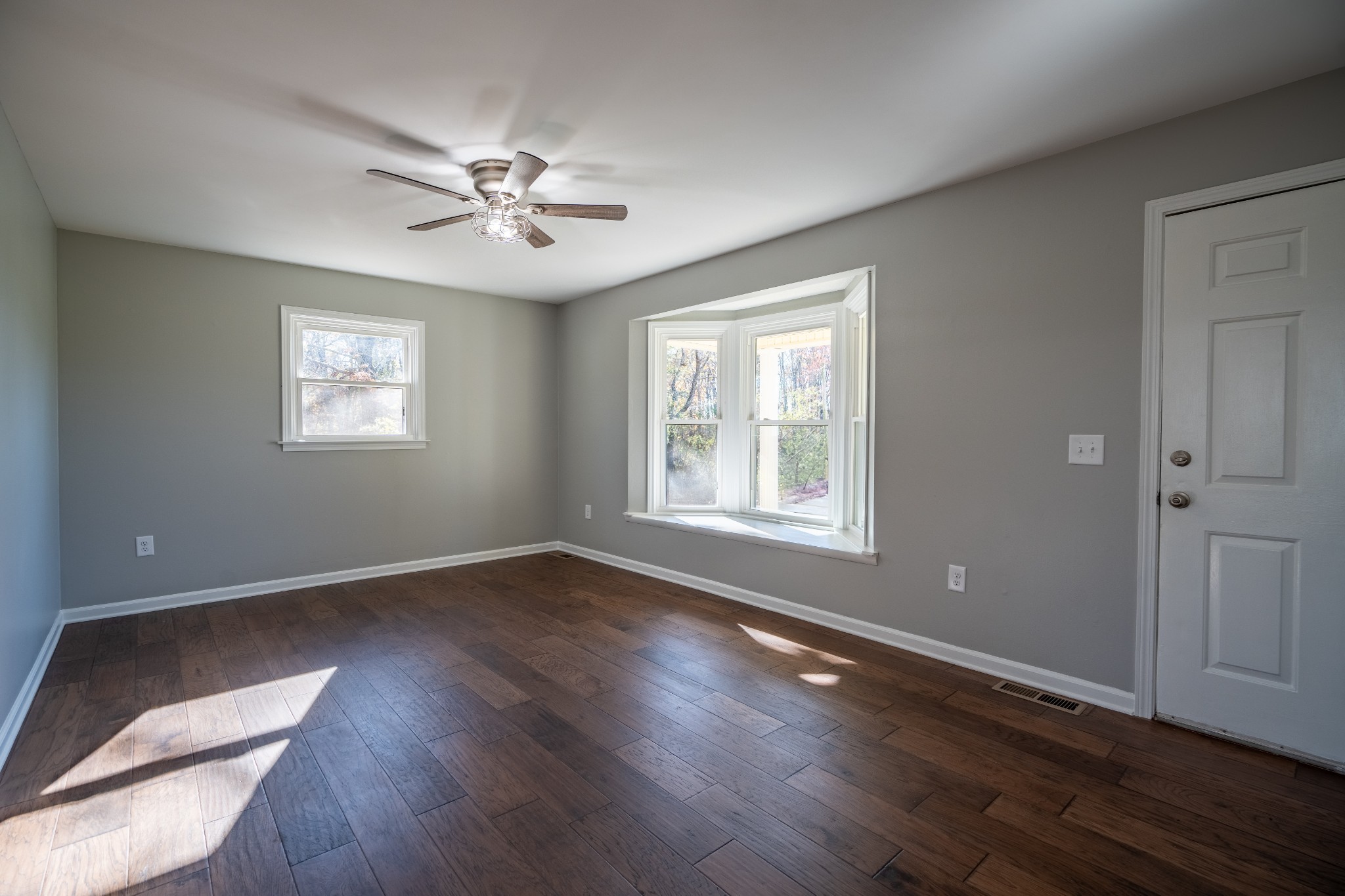 3993 Clanton Road Lawrenceburg, TN 38464 - Photo 9 of 24 a view of an empty room with wooden floor and a window