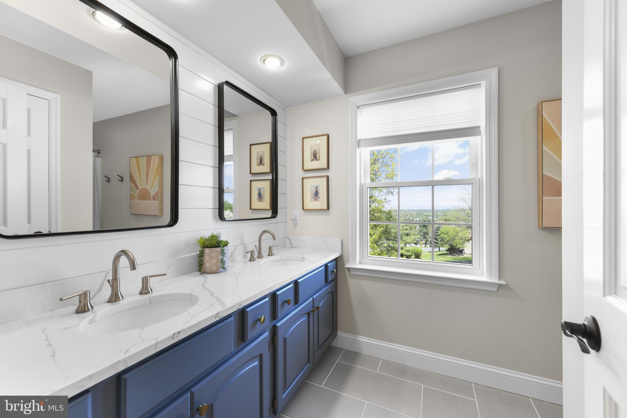 530 Arrowhead Trail Sinking Spring, PA 19608 - Photo 29 of 52 a bathroom with a double vanity sink and a mirror