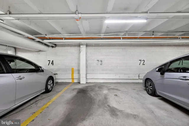 a view of parking garage with cars