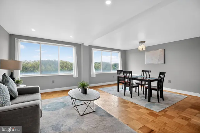 a living room with furniture and a table