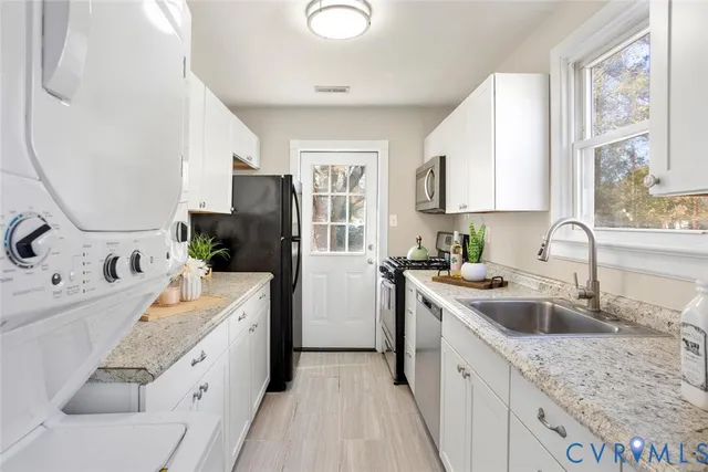 a kitchen with a sink stove and refrigerator