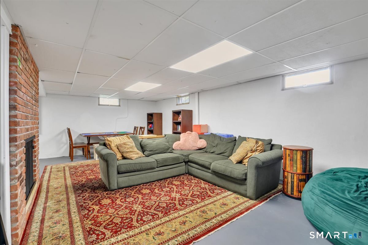 72 Old Post Road Wethersfield, CT 06109 - Photo 29 of 40 a living room with furniture rug and a couch