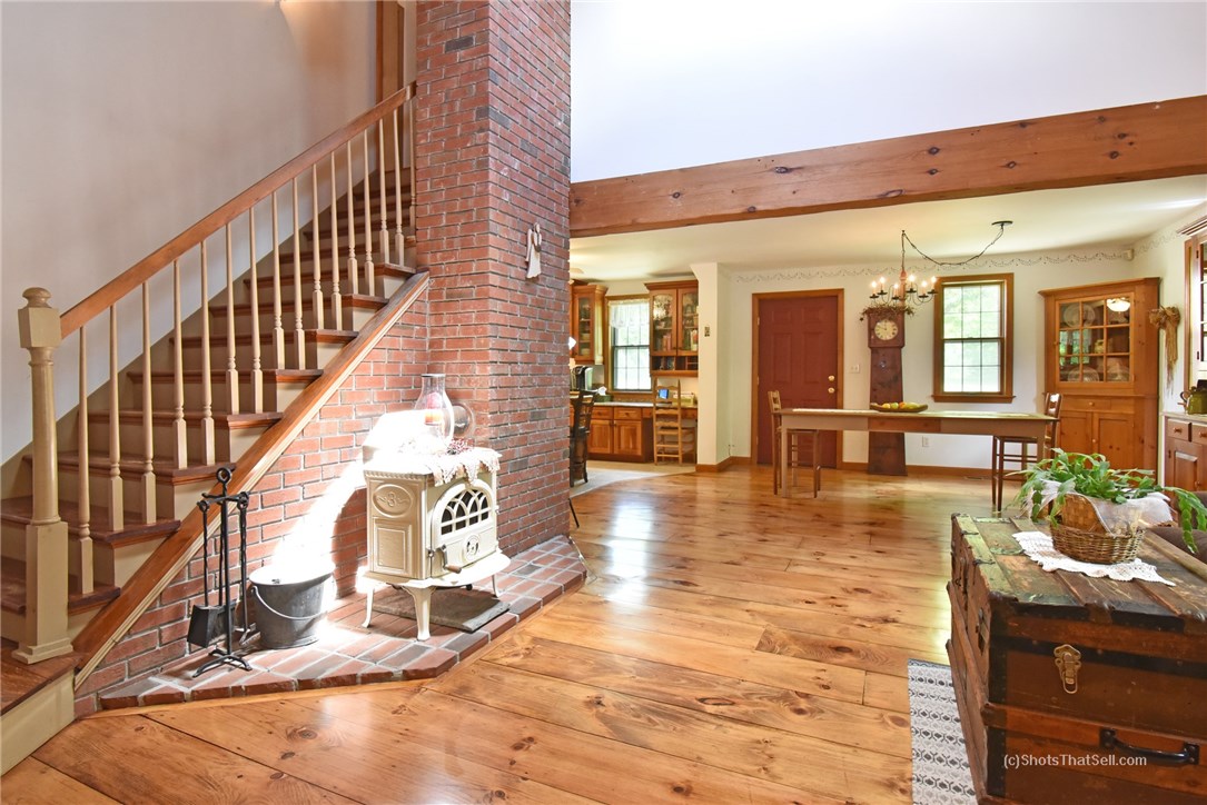 485 Plain Road West Greenwich, RI 02817 - Photo 8 of 40 Living room, dining area, and stairs to 2nd floor