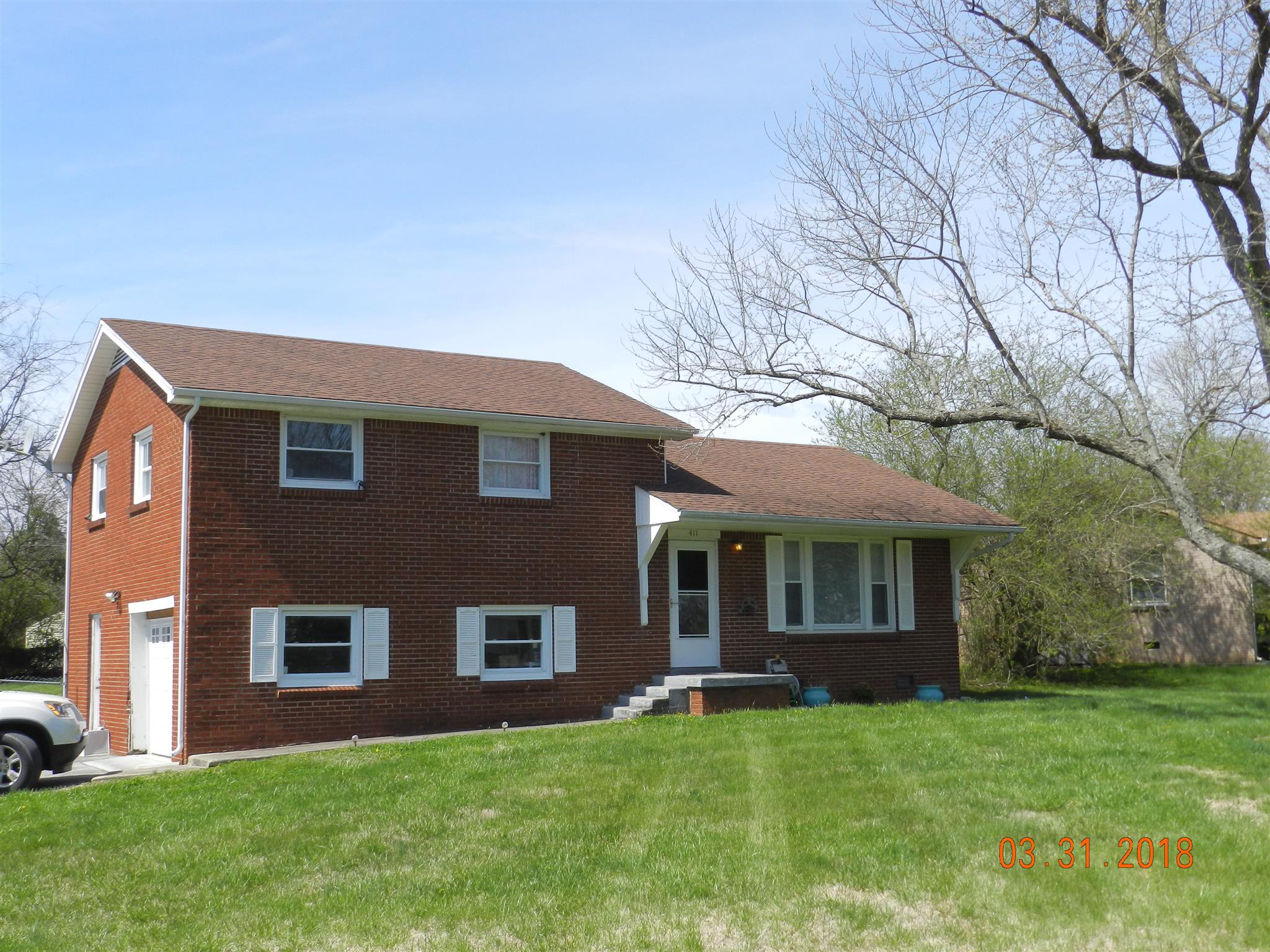 411 Burch Road Clarksville, TN 37042 - Photo 1 of 19 a front view of a house with a yard
