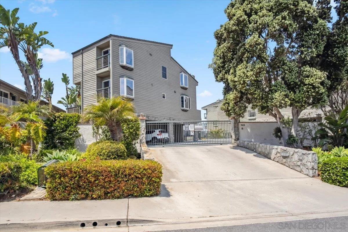 940 Sealane Drive, Unit 5 Encinitas, CA 92024 - Photo 21 of 49 a front view of a house with a yard