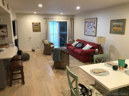 a kitchen with stainless steel appliances a stove microwave and sink